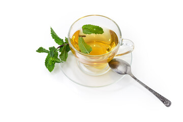 Tea with mint in glass cup on a white background