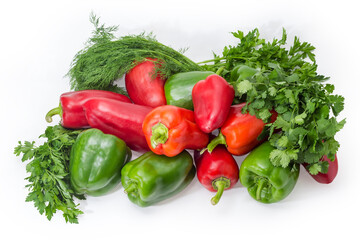 Green and red bell peppers among the different greens