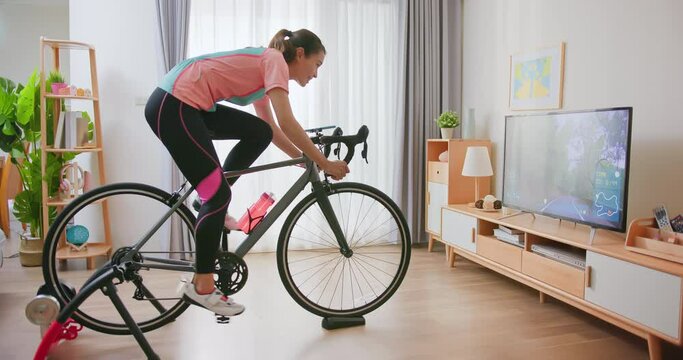 woman ride exercise bike