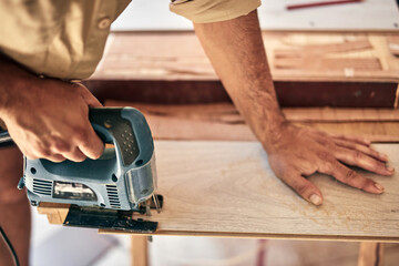 Man assembling furniture and fixing it - hobby concept.