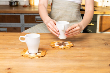Woman keep a cup of beverage in hands