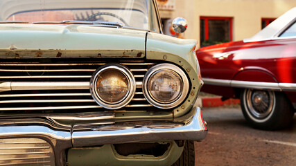 Retro car. Old vintage car. Headlight close up. Exhibition of retro car.