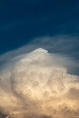 fluffy stormy clouds in the sunset sky
