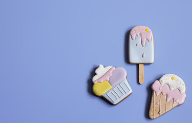 Flat lay bright glazed cookies of different shapes.