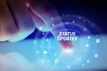 Finger touching tablet with social media icons concept