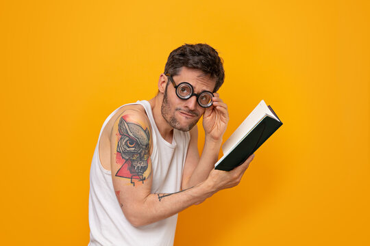 Funny Very Myopic Man Wearing Thick Glasses Reading A Book