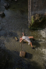 Girl in the water under the bridge