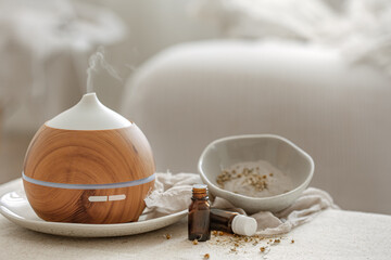 Spa composition with air humidifier and essential oils.