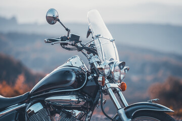 Detail of vintage motorcycle in sunset