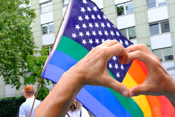 members of LGBTq movement, Gay pride parade in city with rainbow flags, demonstration of people,...
