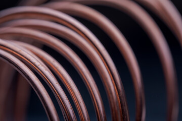 Copper wire non-ferrous metals, product metalworking industry. Abstract metal shapes.