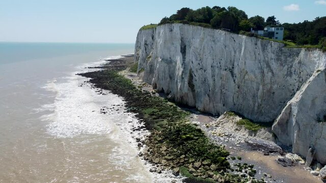 4K drone footage of stunning white cliffs near Dover with erosion