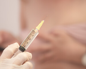 Vaccination concept  background with copy space
. Lipotropic injections close up. Woman Belly fat dissolving treatment. Body lifting injections syringe close up.