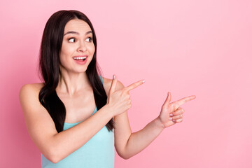 Photo of young girl happy positive smile look point fingers empty space advert decision promo isolated over pastel color background