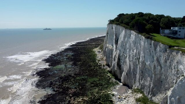 4K drone video flying backwards alongside white cliffs near Dover