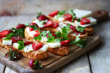 Delicious toast with strawberries and white cheese. Keto toast with strawberries.