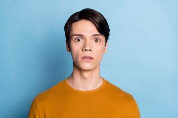 Photo of young guy unhappy sad upset scared fear horror fail problem isolated over blue color background - obrazy, fototapety, plakaty