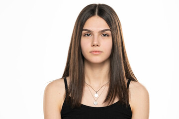 portrait of a beautiful teenage girl with long straight hair and no makeup
