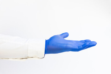 Doctor wearing blue latex Glove. Opened hand. White background. Copy space