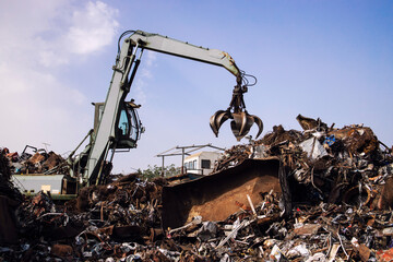 Industrial scrap metal recycling in junkyard. - obrazy, fototapety, plakaty
