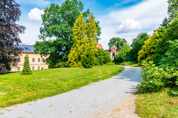 Fototapeta premium Park and Castle Cechy pod Kosirem, Moravia, Czech Republic. Chateau built in empire style. Outdoors view from public park.