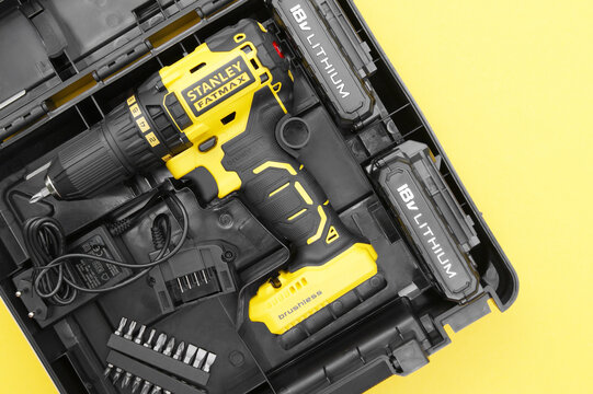 Stanley's new cordless screwdriver in a box on a yellow background .