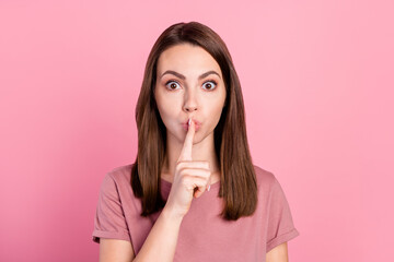 Naklejka premium Photo of silence brunette millennial lady finger lips wear t-shirt isolated on pink color background