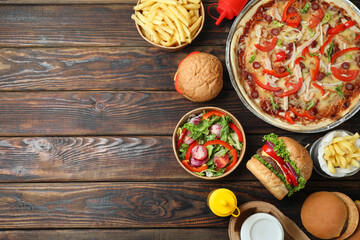 Concept of fast food on wooden table