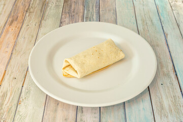 simple closed burrito of tortilla stuffed with wheat of whatever you want to imagine.