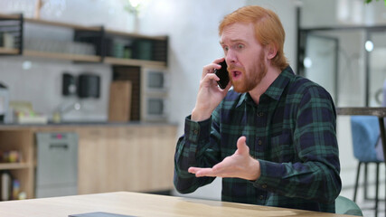 Angry Redhead Man Talking on Phone 