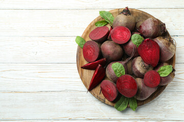 Ripe red beet on white wooden table