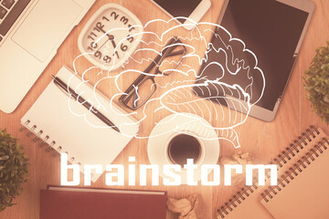 Multi exposure of creative drawing over table with phone. Top view. Concept of startup.