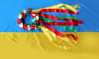 Traditional Ukrainian wreath with multi-colored ribbons on a yellow-blue flag. Flag Day, Independence, Constitution of Ukraine