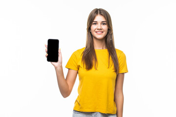 Portrait of a smiling woman showing blank smartphone screen on a white background