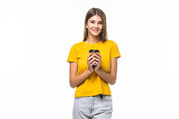 Young beautiful woman offers white cup of coffee on gray background