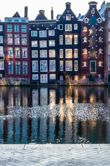 Colorful houses along the canal in Amsterdam, the Netherlands