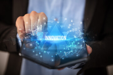 Businessman holding a foldable smartphone, business concept