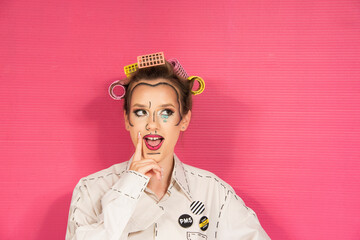 Girl with POP ART make up face paint style, isolated on pink background