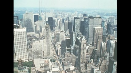 Midtown Manhattan aerial view on Bryant Park of New York city with historic taxi on the road. Archival skyline of New York on Central Park side in 1970s. Vintage United States of America in 1976.