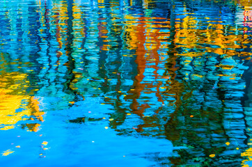 Colorful illustration of the buildings reflection along the canal in Amsterdam in the autumn