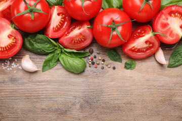 Flat lay composition with fresh green basil leaves on wooden table, space for text