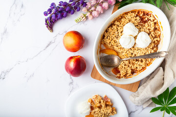 Homemade nectarine crumble with vanilla ice cream