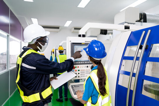 African American engineer use clipboard to working in factory