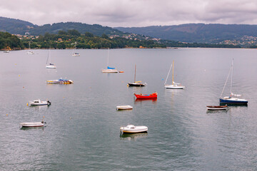 Fototapeta na wymiar Panoramic view with sailor boats near a small village