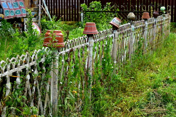 wrought iron fence and ceramic pots