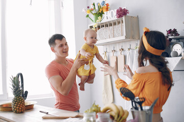 Beautiful family prepare food in a kitchen