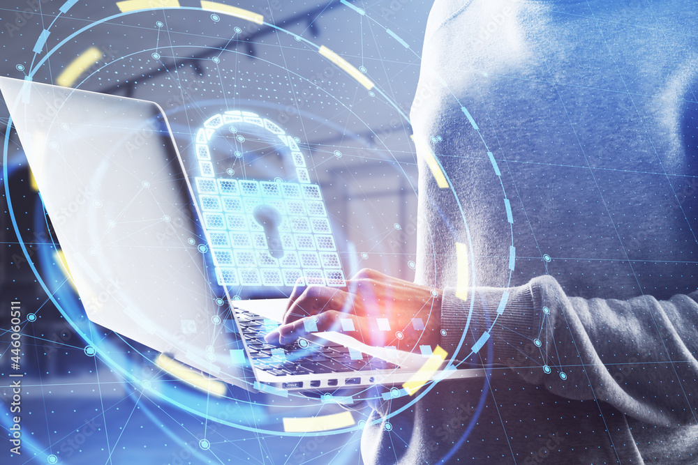 Poster close up of hacker hands using laptop with glowing padlock hologram on blurry office background. onl