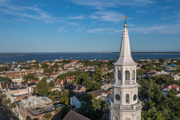 Close up aerial view of Broad street Charleston, South Carolina port city,  Saint Michael's white church tower historic landmark