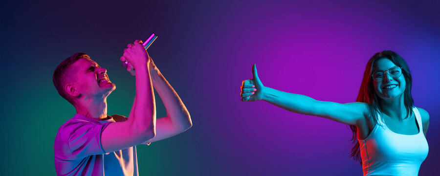 Two people, young man and woman singing and listening isolated on gradient background in neon light, collage.