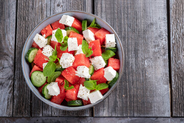 Summer salad with watermelon, mint, cucumber and feta cheese close up